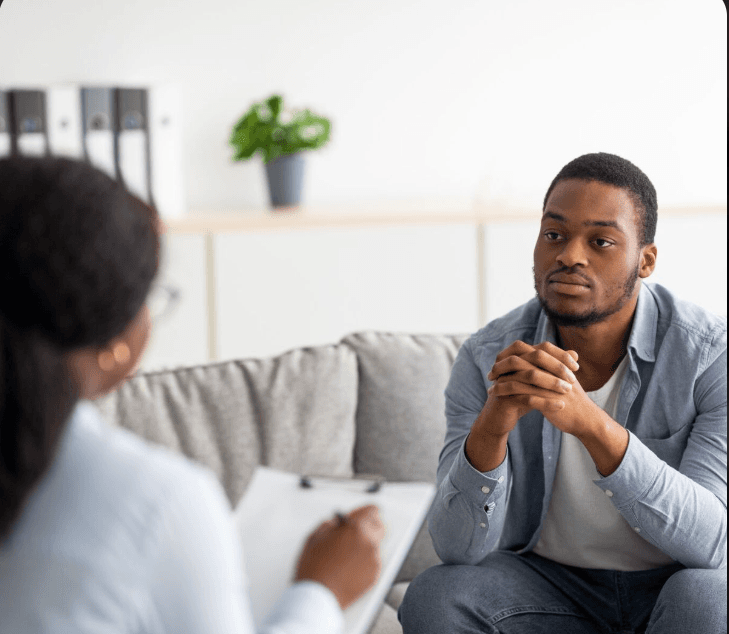 A provider listening to a patient face-to-face during a supportive session