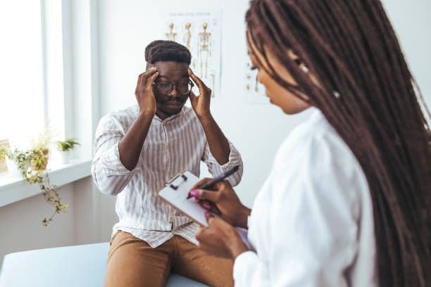 A provider supporting a patient during a therapy session